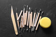 Set of different clay crafting tools and pottery sponge