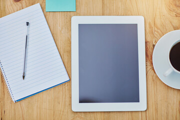 Poster - High angle, desk and tablet or paper in zoom with coffee, workspace with technology for background. Notebook, epad and above on table with drink in closeup, internet or app for marketing business