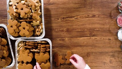 Wall Mural - Making Festive Gingerbread Sandwiches on Rustic Wooden Table