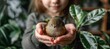 Young girl gently holding small bird, symbolizing care for animals and promoting animal welfare