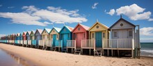 Row Of Colorful Beach Huts On The Beach.
