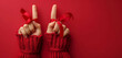 Festive Red Knitted Gloves Holding Satin Ribbons Symbolizing Peace on Red Background