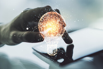 Poster - Double exposure of creative light bulb hologram with finger clicks on a digital tablet on background, research and development concept