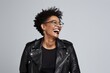 © Markus Schröder - Portrait of a happy afro-american woman in her 40s sporting a classic leather jacket on white background