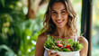 A fit woman holds a bowl of fresh salad, reflecting a post-workout nutrition routine. Active Lifestyle and Healthy Diet Concept