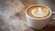 An intimate closeup of a freshly brewed latte in a white ceramic cup, the focus is on the contrast between the rich, creamy milk and the deep espresso, creating a beautiful marbled effect The cup is s