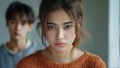 © Janjira - An Asian couple is experiencing relationship issues after a fight, leading to feelings of sadness and frustration. The husband and wife are upset and arguing, causing tension within their family.