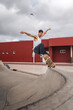 © magui RF - young man skating a ramp in a skate park