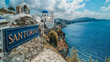 Postcard. Picturesque image of Santorini with blue domes and white buildings.