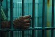 © BajimBa - Close-up of the hands and wrists in prison, holding onto the bars with their hands, crime and punishment, violation of the law and consequences, a prisoner in prison