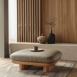 © VISUAL BACKGROUND - A leather ottoman with wooden legs.
