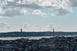 view of the city of Lisbon, Portugal. Panorama of the city from the viewing point. Panoramic view of the beautiful skyline of Lisbon, Portugal, with red roofs, colorful houses. View of the April 25 Br