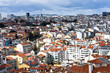 view of the city of Lisbon, Portugal. Panorama of the city from the viewing point. Panoramic view of the beautiful skyline of Lisbon, Portugal, with red roofs, colorful houses in the Alfama district o