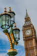 The Elizabeth Tower that hosts the bell Big Ben and one of the many ornate lanterns in the city of Westminster,, London, England 