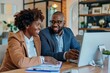 © LidiaLens - A happy adult black couple looking at their next house on the computer
