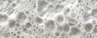 Soft white soap foam as background closeup. Soft White Soap Bubbles Closeup