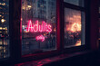 Pink neon light sign with  'Adults only' text hanging in window of bar at night