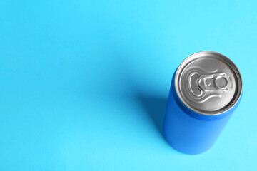 Sticker - Energy drink in can on light blue background, above view. Space for text