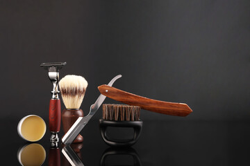 Wall Mural - Moustache and beard styling tools on black mirror surface. Space for text