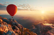 A colorful hot air balloon floats gracefully above mountainous landscape during a vibrant sunset