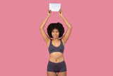 Fototapeta Tulipany - Concerned African American woman holding a calendar