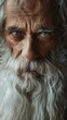 Wise elder with a flowing white beard a visage of ancient stories under soft focused light