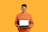 Fototapeta  - Guy presenting laptop with blank screen to camera