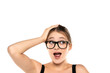 Expressive Beauty: Portrait of a Surprised Young Woman with Makeup and Glasses, Updo, Holding Head and Raised Eyebrows on White Background