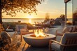 © Aksana - Outdoor modern fire pit in backyard with gray modern outdoor furniture, chairs, on the terrace of a residential building at sunset concept of relaxation rest and communication