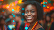 Black american young woman wearing a graduation cap dancing at the party. Festive bokeh background