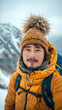 Happy Asian hiker man taking selfie portrait on the top of mountain, vertical format