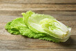 Cut fresh Chinese cabbage on wooden table