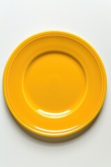 Poster - A simple yellow plate on a clean white surface. Suitable for food or kitchen-themed designs