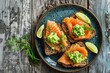 Toast bread with salted salmon and guacamole avocado on wooden table
