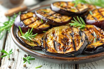 Wall Mural - Grilled eggplants in plate on wooden table