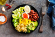 Buddha bowl, balanced food, vegetarian menu. Eggs, avocado, salad lettuce, bulgur, spice