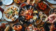 Assortment of seafood dishes on table with white wine glasses for elegant dining experience
