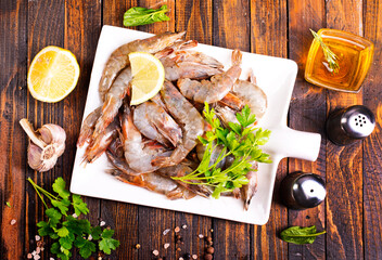 Poster - Uncooked Raw peeled tiger white shrimp prawn. wooden background.