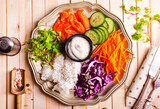 Fototapeta Tulipany - salmon salad with rice, fresh vegetables and sunflowers seed