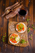 Tasty bruschetta with salmon. Salmon toast with cream cheese, arugula and sunflower seeds
