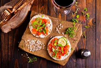 Sticker - Tasty bruschetta with salmon. Salmon toast with cream cheese, arugula and sunflower seeds