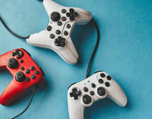 Set of lying gamer joysticks or gamepads on monochrome background