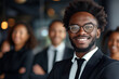 Generative AI illustration of upbeat African American man in business attire with a beaming smile, leading a team of professionals blurred in the background