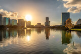Fototapeta Miasta - Orlando city skyline at sunset with fountain and cityscape, Florida, USA
