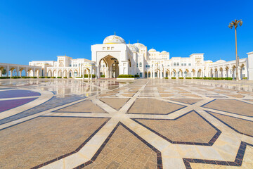 The white marble facade and decorated courtyard at the entrance to Qasr Al Watan, the Royal Presidential Palace in Abu Dhabi, United Arab Emirates.