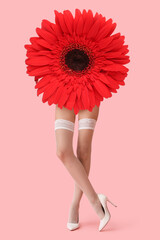 Wall Mural - Legs of beautiful young woman in white stockings on pink background