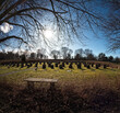 The sun is setting over unesco heritage Woodland cemetery in sweden.