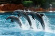 © SaroStock - Graceful dolphins leaping in synchronized harmony, A mesmerizing display of dolphins gracefully leaping out of the water in perfect synchronization