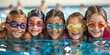 Group of happy kids learning swimming in indoor summer pool. Happy children kids group at swimming pool class learning to swim, happy summer vacation.