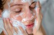 © Татьяна Евдокимова - A daily gentle facial cleansing routine for healthy and glowing skin with foamy cleanser, perfect for women's skincare regimen and personal hygiene